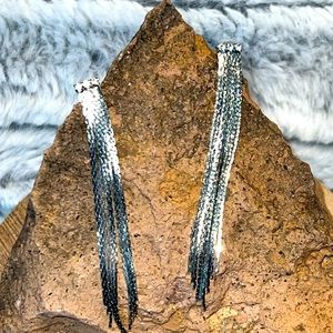Long sexy silver color post earrings with rhinestones.